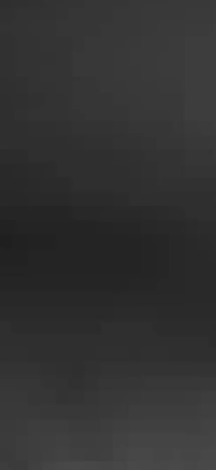 Dark, heavily blurred frame, nearly black, with only faint indistinct shapes visible.
