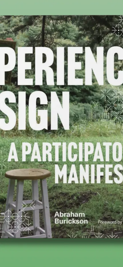 Zoomed in further on the book cover's title lettering and the stool in the grass